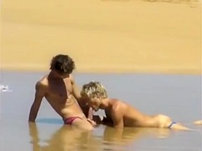 Boyfriends enjoy sex on the beach...