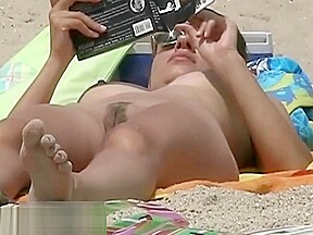 Babe lying down beach surprised by...