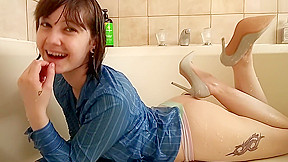 Shower strip in jeans and heels...