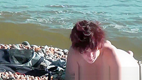 Beautiful nudist babes on beach posing...