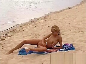 Ladies playing nude on beach...