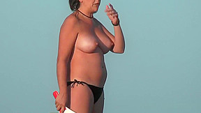 Hot babe sunbathing beach...