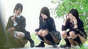 3 japanese schoolgirls pee together outside...