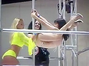 Women in bikinis and leather pole...