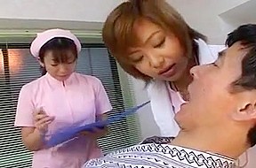 Japanese dentist and nurse spitting on...