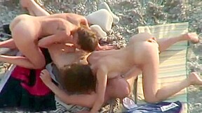Couples fuck right on the beach...
