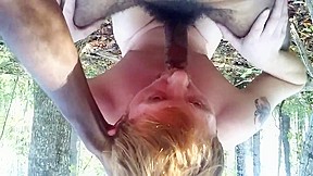Horny redhead cocksucker in woods sucking...