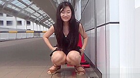 Fetish asian whore peeing in gutter...