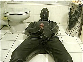 Latex Encased Person Masturbating On Toilet...