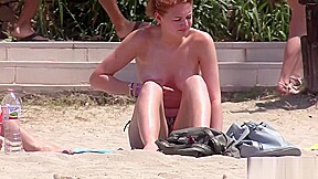 Busty Redhead Topless Beach...