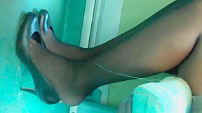 Feet legs in blk nylons pantyhose...