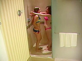 Junior girls get naughty in the shower...