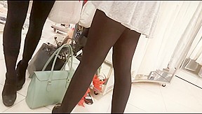 Sexy girl in mini skirt and black pantyhose upskirt