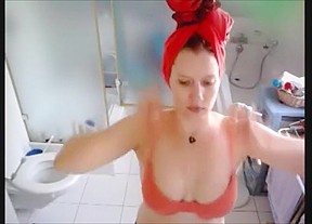 Blond baby takes a shower after...