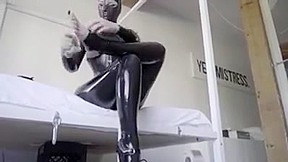 Hooded rubber woman catsuit and ballet boots...