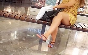 Her sexy crossed legs short skirt...