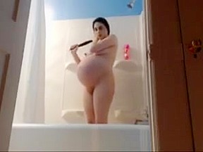 pregnant latina huge belly in te bathroom