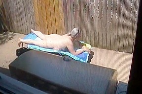 Caught laying out nude enjoy the view...