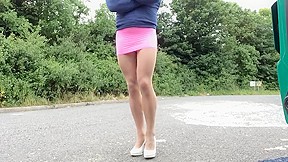 Crossdresser outdoors in tan pantyhose and...