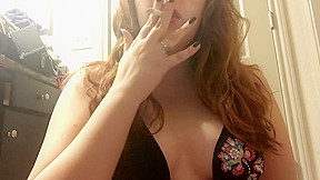 Chubby redhead teen smoking bikini top...