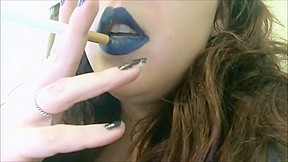 Chubby teen in dark lipstick smoking...