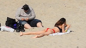 Butt on beach in bikini...