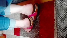 Sexy female feet in pink shoes...
