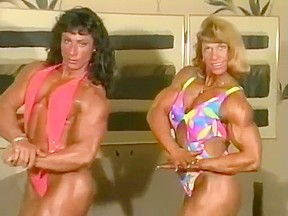 2 sexy fbb muscle women flexing...