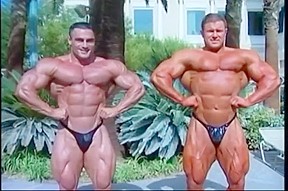 Two extreme lean bodybuilders flexing...