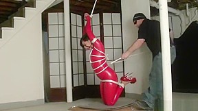 Bondage in straigh latex catsuit and...