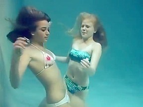 Two girls and posing underwater...