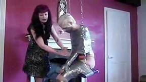 Blonde girl completely tape mummified to...