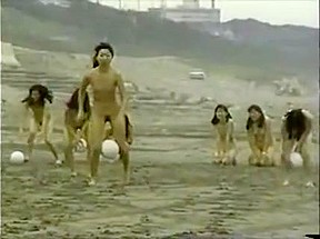 Naked Women Race Across With A Ball Between Their...