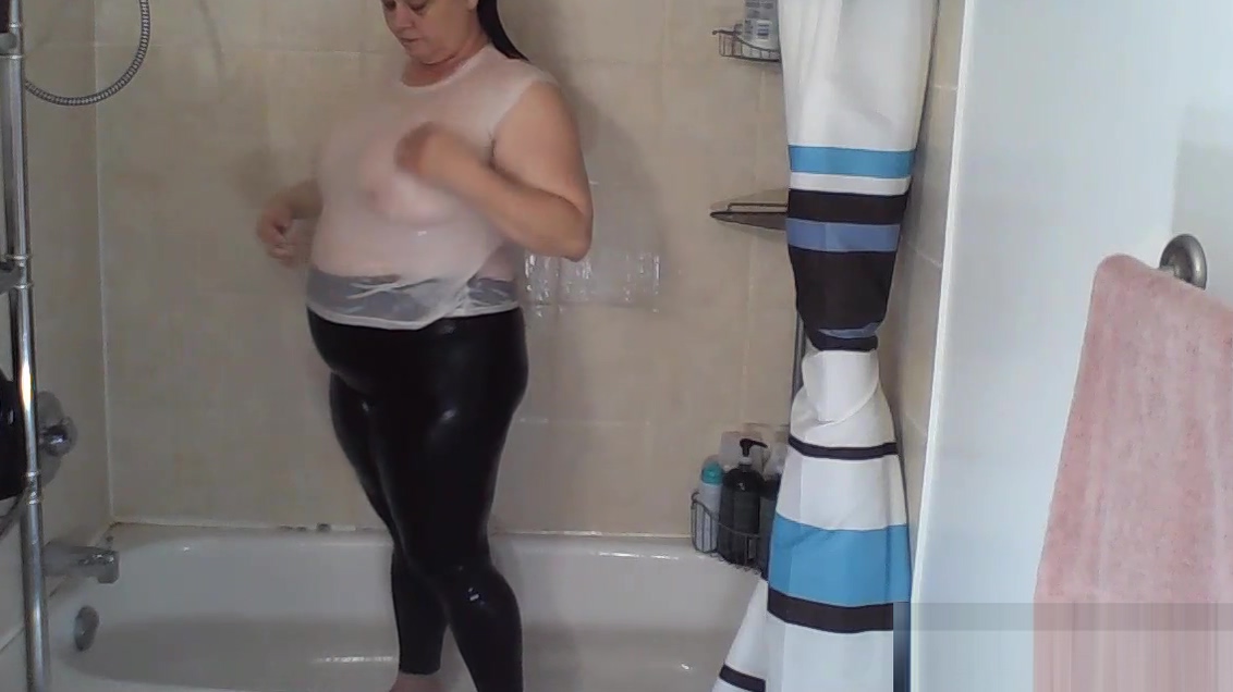 Shower In White Tank Top And Black Leggings