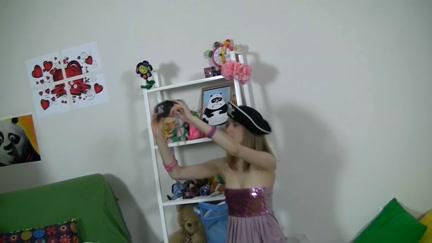 Cute angel plays with hot toys and bear